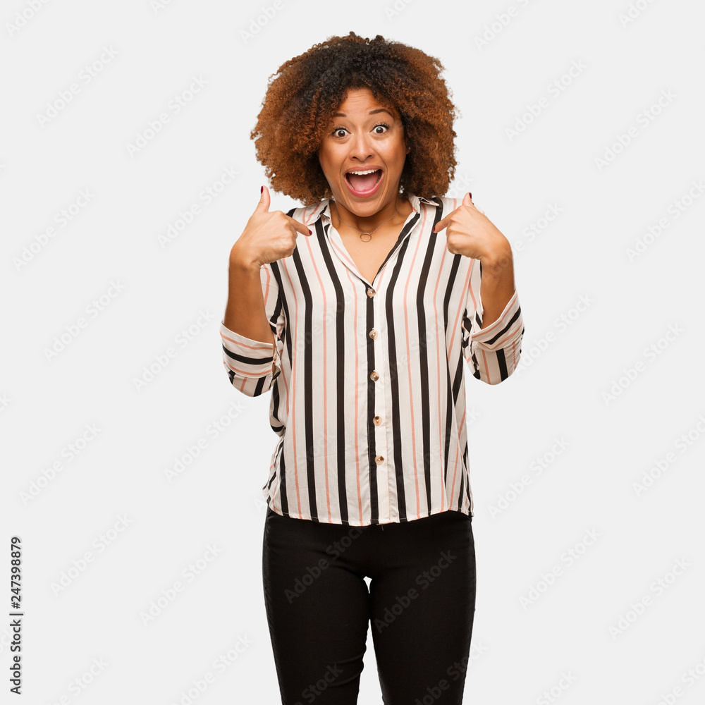 Young black afro woman surprised, feels successful and prosperous Young black afro woman surprised, feels successful and prosperous