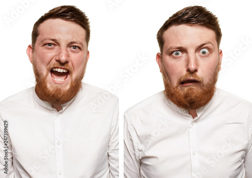 Studio portrait of young handsome smiling man with beard