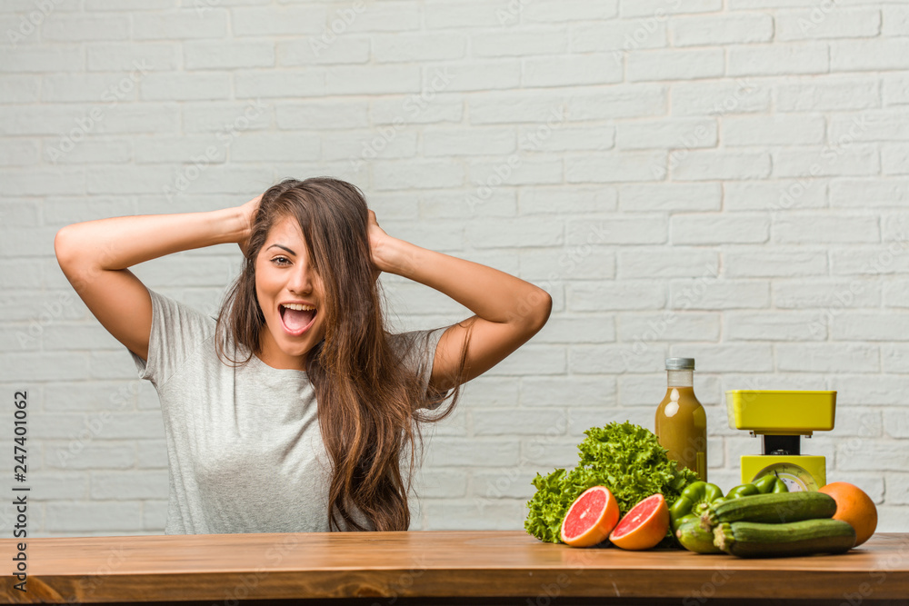Concept of diet. Portrait of a healthy young latin woman surprised and shocked, looking with wide eyes, excited by an offer or by a new job, win concept Concept of diet. Portrait of a healthy young latin woman surprised and shocked, looking with wide eyes, excited by an offer or by a new job, win concept