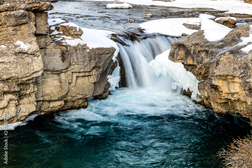Elbow Falls and the Elbow River early thaw, Elbow Falls Provincial Recreation Area, Alberta, Canada