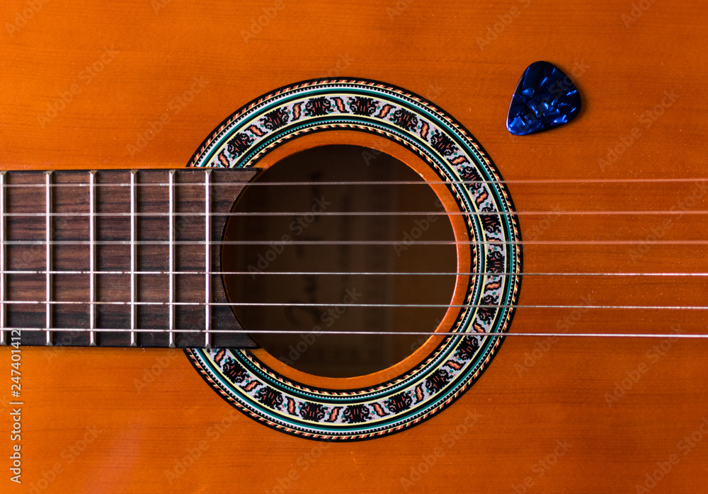 Obraz premium Classical wooden guitar strings close up