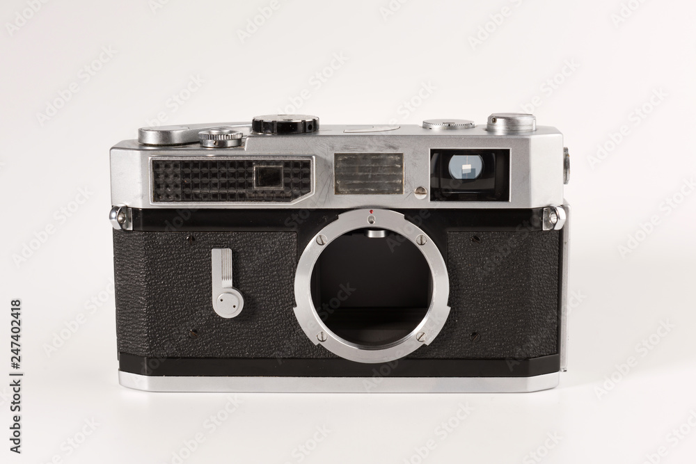 An old film camera is isolated on a white background