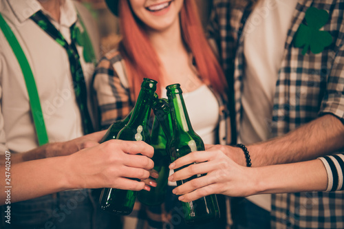 Cropped close up photo gathering company together tell speak talk toast tradition culture carefree guys best friends ever weekend vacation hands raise beer bottles glad meeting ginger red hair