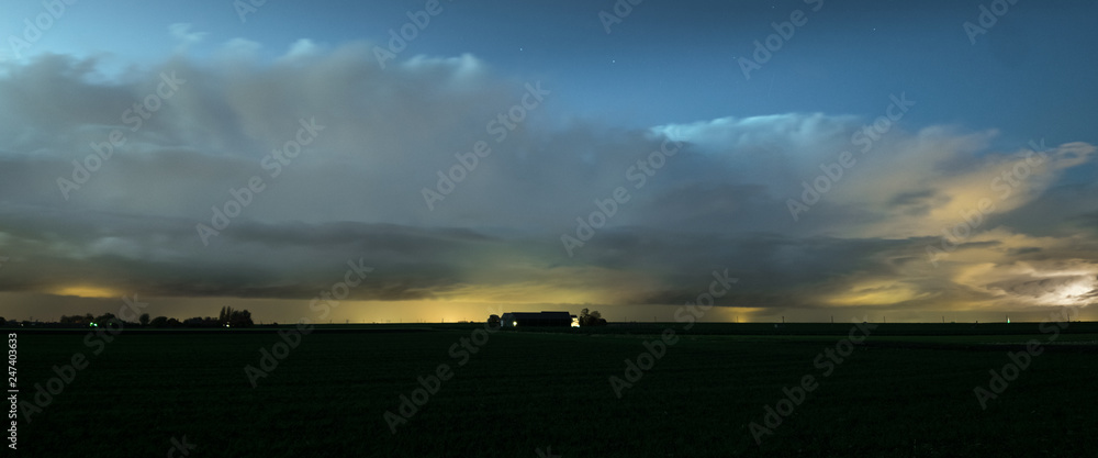 Panorama of autumn thunderstorms along the dutch coast.  Thundery showers with beautiful anvils in a row. Occasionally lightning could be observed from these storms.
