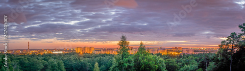 a panorama view of the city of Tallinn with a pink sky. 