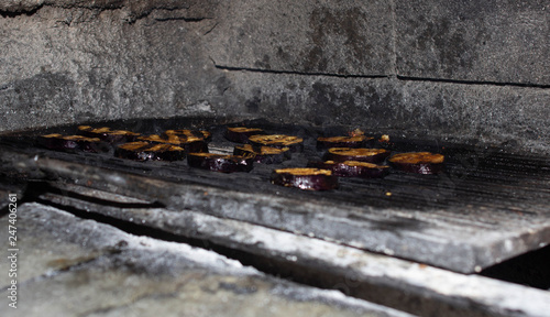 Eggplant slices are grilled in the oven, grilled vegetables, close-up, brinjal