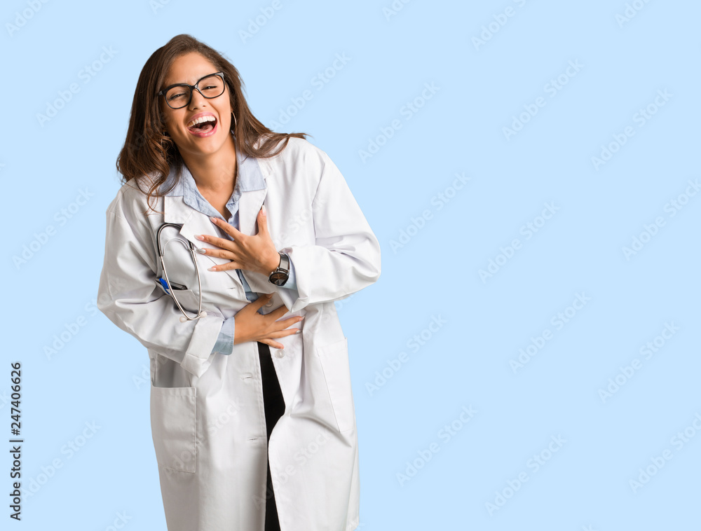 Full body young doctor woman laughing and having fun Full body young doctor woman laughing and having fun
