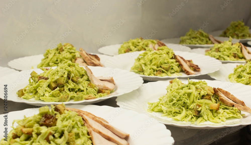 Several servings of cabbage and ham salad, appetizer, banquet preparation, crackers Several servings of cabbage and ham salad, appetizer, banquet preparation, crackers