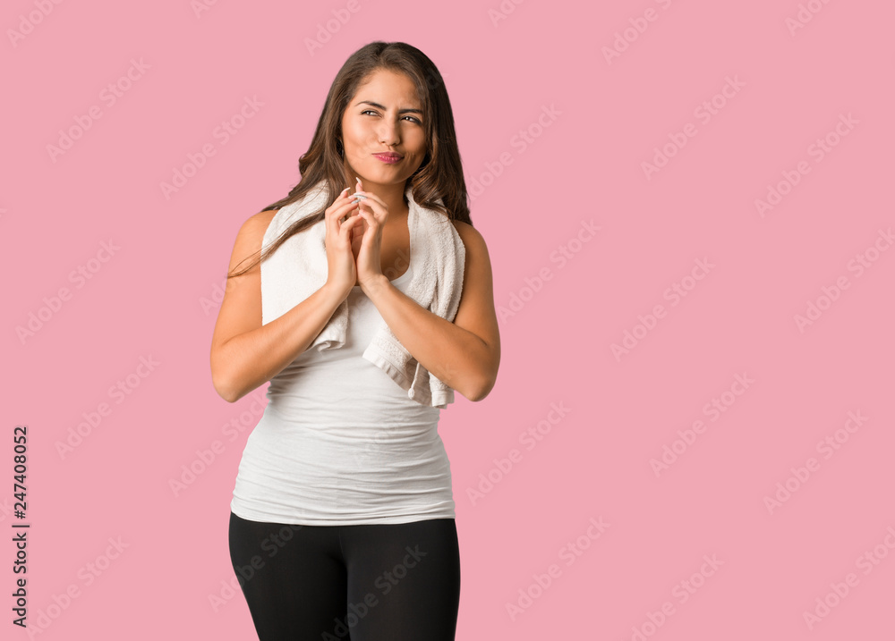 Full body young fitness curvy woman devising a plan Full body young fitness curvy woman devising a plan