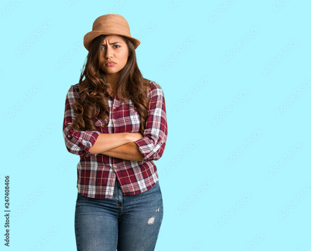 Full body young traveler curvy woman crossing arms relaxed Full body young traveler curvy woman crossing arms relaxed