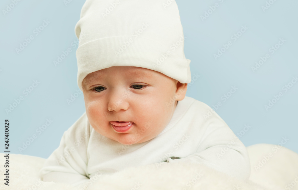 emotional newborn beautiful tender baby lies on a white blanket. The concept of health emotional newborn beautiful tender baby lies on a white blanket. The concept of health