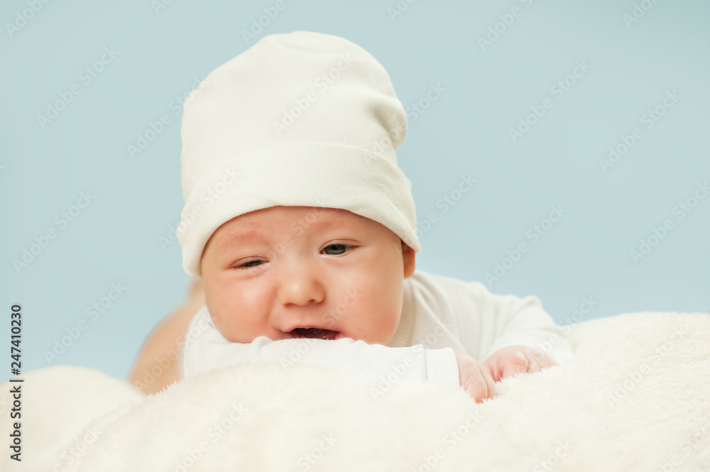 emotional newborn beautiful tender baby lies on a white blanket. The concept of health emotional newborn beautiful tender baby lies on a white blanket. The concept of health