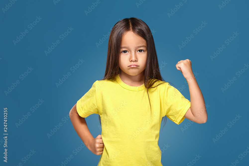Angry little kid showing frustration and disagreement Angry little kid showing frustration and disagreement