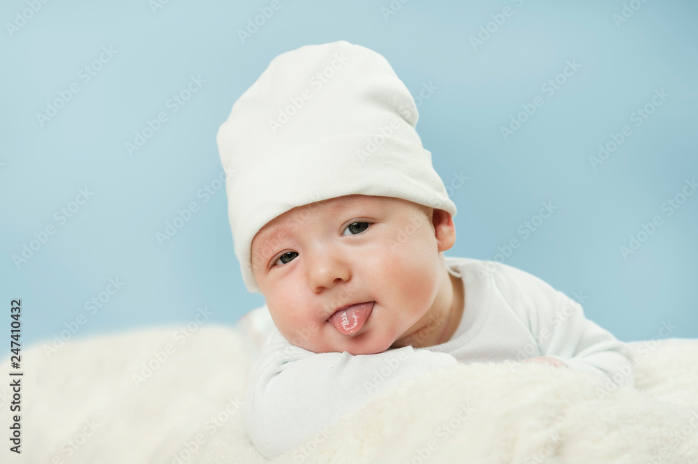 emotional newborn beautiful tender baby lies on a white blanket. The concept of health emotional newborn beautiful tender baby lies on a white blanket. The concept of health