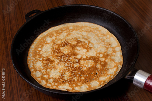 Thin pancakes with crispy crust. Maslenitsa. Pancakes for breakfast and carnival.