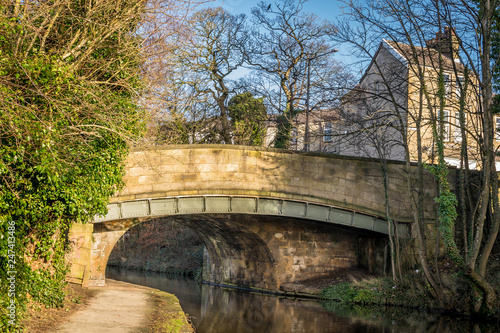 a road bridge over the Lancaster canal. A tow path under a bridge.  photo