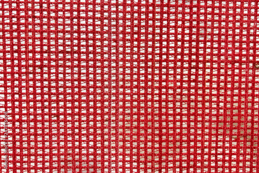 Red mesh fabric, close-up, background, texture Red mesh fabric, close-up, background, texture