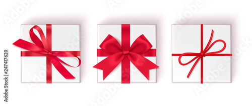 Set of decorative white gift boxes with red bow and ribbon isolated on white background. Top view. Vector illustration
