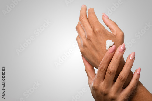 female hands applying cream