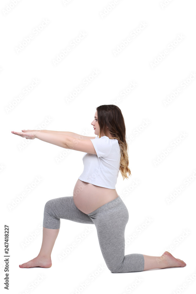 Young pregnant woman doing exercises on white background Young pregnant woman doing exercises on white background