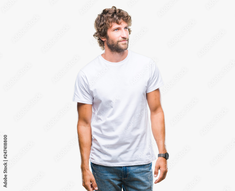Handsome hispanic model man over isolated background looking away to side with smile on face, natural expression. Laughing confident. Handsome hispanic model man over isolated background looking away to side with smile on face, natural expression. Laughing confident.