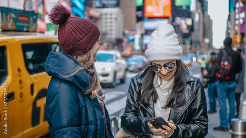 Two friends enjoy their vacation trip to New York