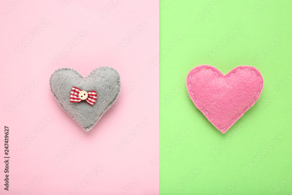 Fabric hearts on colorful background