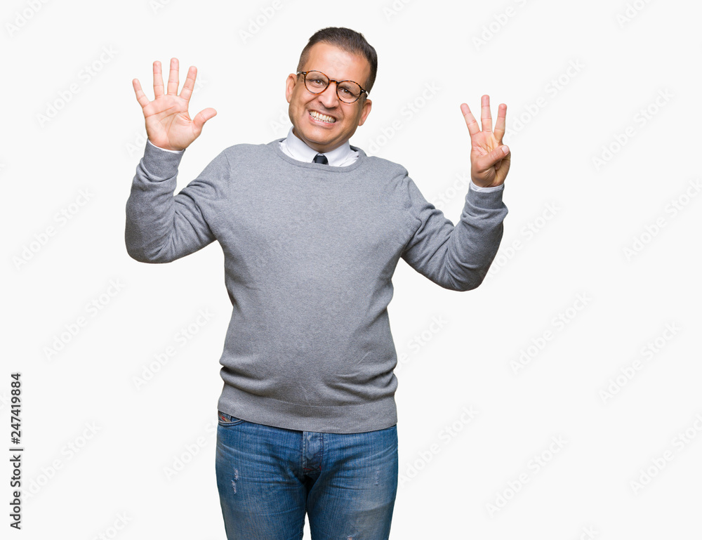 Middle age bussines arab man wearing glasses over isolated background showing and pointing up with fingers number eight while smiling confident and happy. Middle age bussines arab man wearing glasses over isolated background showing and pointing up with fingers number eight while smiling confident and happy.