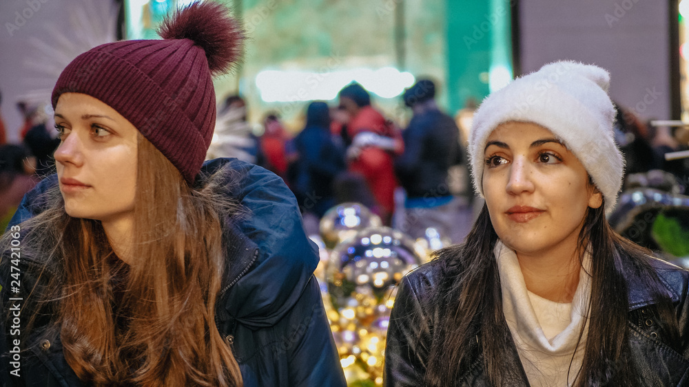 Two girls enjoy the wonderful Christmas time in New York