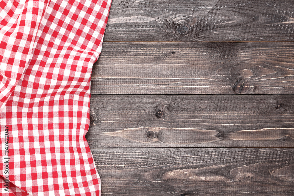 Red napkin on wooden table Red napkin on wooden table