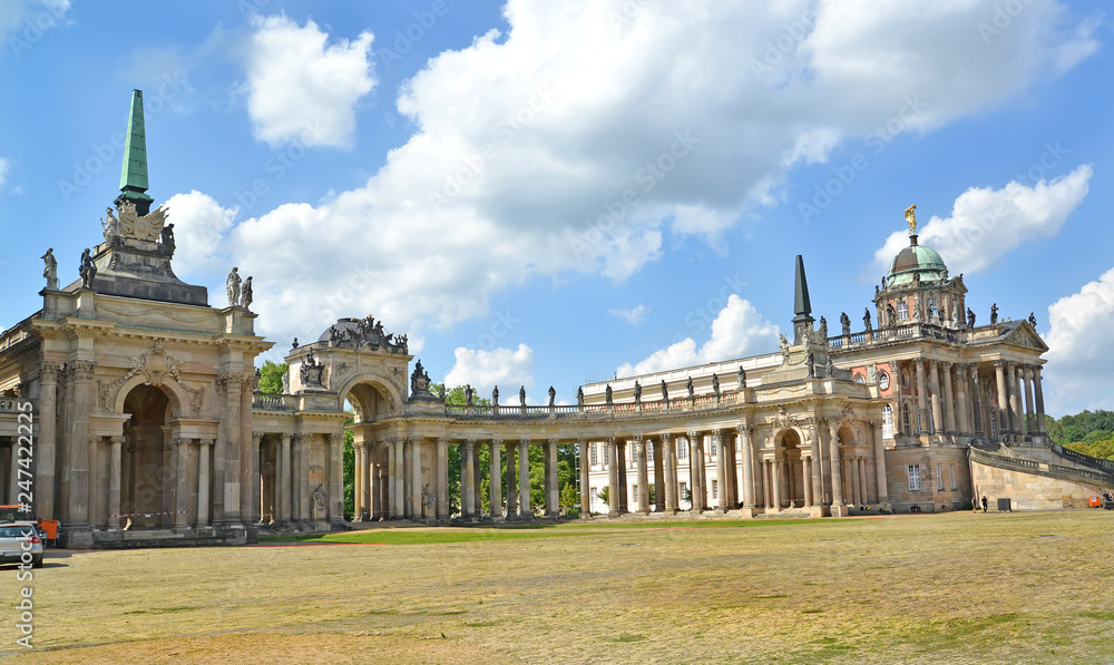 POTSDAM, GERMANY. A view of a colonnade and the New palace (a campus of the Potsdam university) in summer day. Park of San Sushi