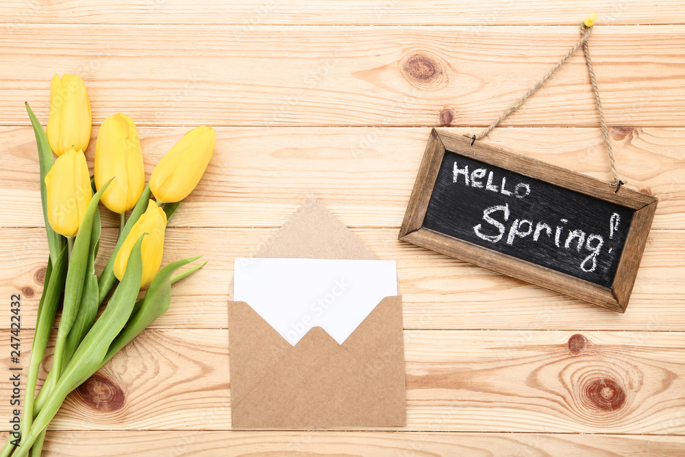 Bouquet of yellow tulips with envelope and text Hello Spring Bouquet of yellow tulips with envelope and text Hello Spring