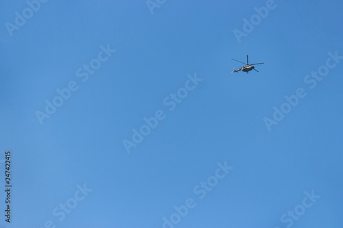 blue sky on which helicopter flies