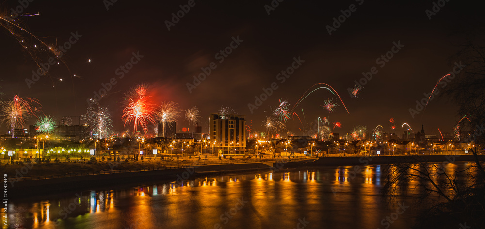 panorama of great fireworks over the night Krasnodar reflected in the river