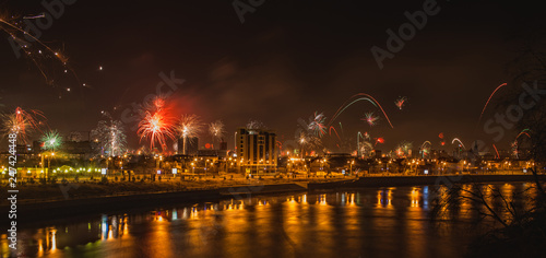 panorama of great fireworks over the night Krasnodar reflected in the river