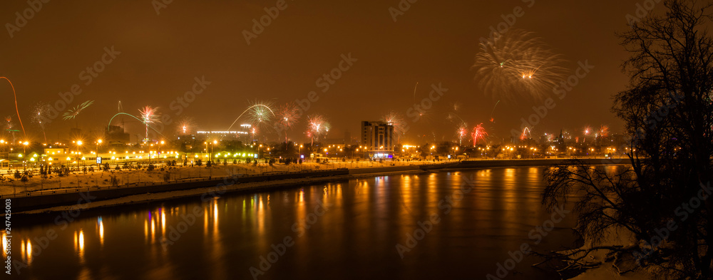 panorama of fireworks in honor of the new year near the river Kuban panorama of fireworks in honor of the new year near the river Kuban