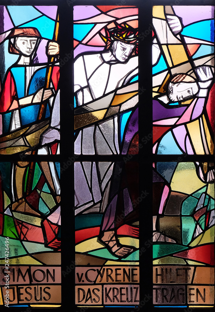 5th Stations of the Cross, Simon of Cyrene carries the cross, stained glass window in Saint Lawrence church in Kleinostheim, Germany