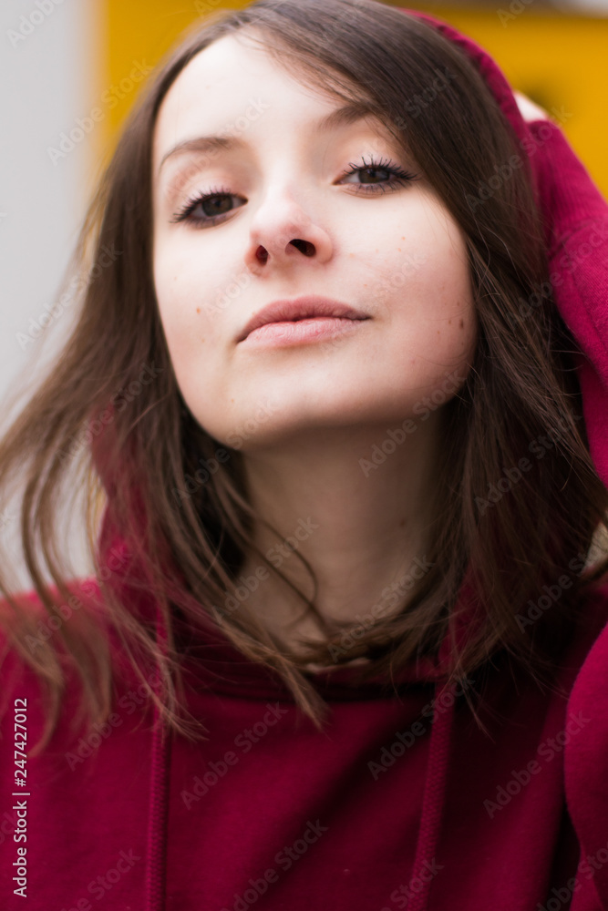 big eyes, sweet girl in burgundy hoodie, smiling and looking at you big eyes, sweet girl in burgundy hoodie, smiling and looking at you