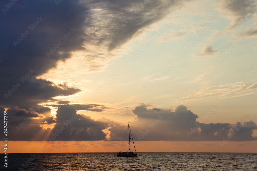 Skyline view of the Black sea seaside with sunset cloudy sky and boat silhouette in Batumi, Georgia Skyline view of the Black sea seaside with sunset cloudy sky and boat silhouette in Batumi, Georgia