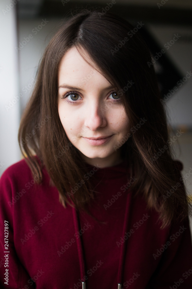 big eyes, sweet girl in burgundy hoodie, smiling and looking at you big eyes, sweet girl in burgundy hoodie, smiling and looking at you