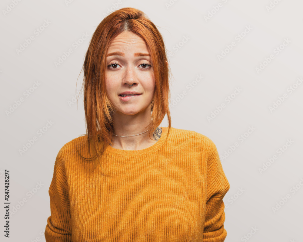 portrait of a pretty redhead girl realizing about something portrait of a pretty redhead girl realizing about something