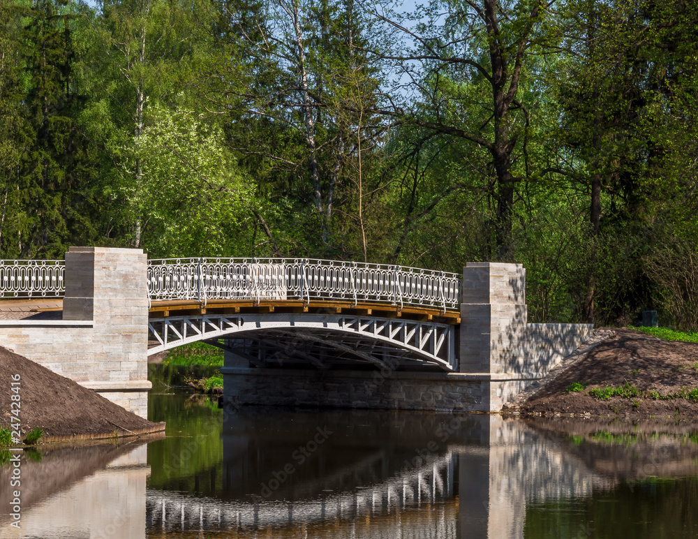 Stone bridge over the river in the park