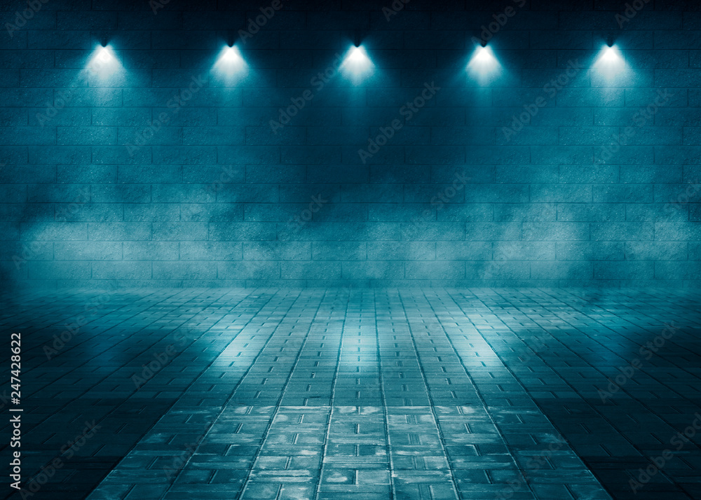 The background of an empty room with brick walls and concrete floor tiles. Blue neon light, spotlight, smoke