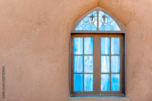 Colorful window of San Geronimo de Taos Spanish mission church, Taos Pueblo, New Mexico photo