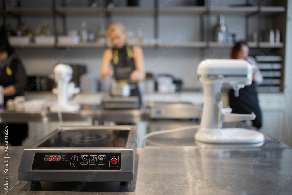 Fototapeta premium Kitchen scales on the background of the kitchen