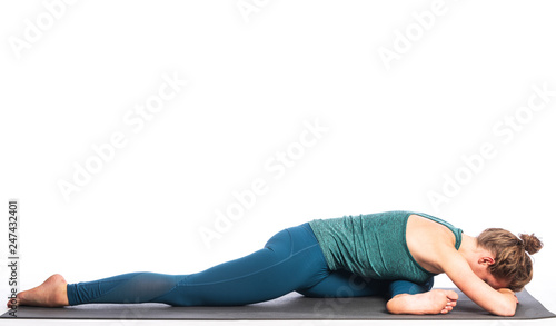 Athletic young blonde woman doing yoga practice isolated on white background. Concept of sport - healthy life and natural balance between body and spiritual development