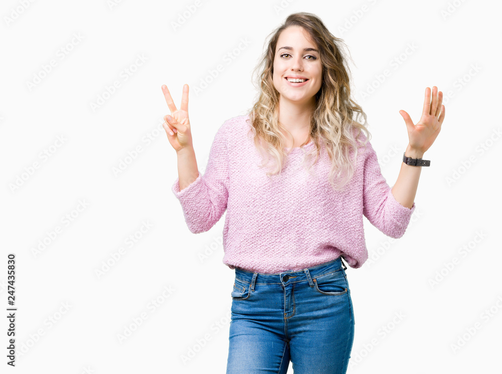 Beautiful young blonde woman over isolated background showing and pointing up with fingers number seven while smiling confident and happy. Beautiful young blonde woman over isolated background showing and pointing up with fingers number seven while smiling confident and happy.