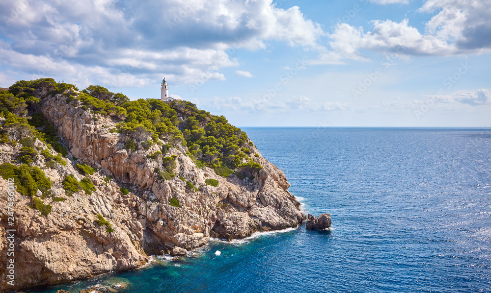 Scenic landscape with Capdepera Lighthouse in distance, Mallorca, Spain.