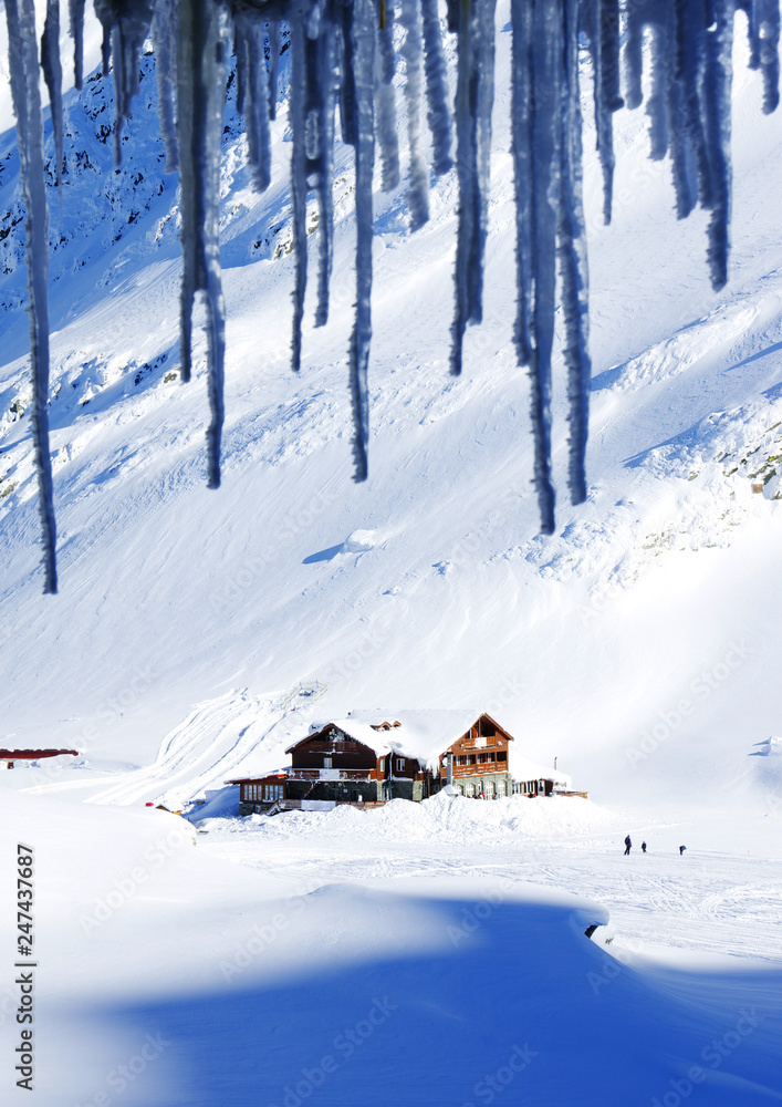 Chalet covered with snow in the Transylvanian Alps, Balea Valley, Romania, Europe