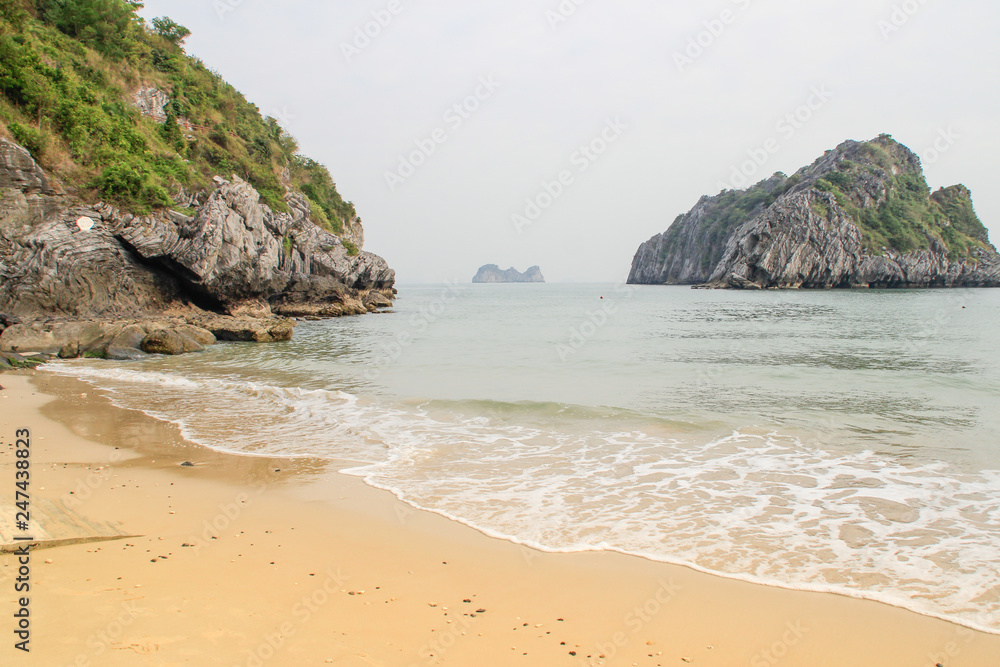 Stunning views of the quaint cliffs and the sea with turquoise water in the most famous place in Vietnam - Ha Long Bay. Stunning views of the quaint cliffs and the sea with turquoise water in the most famous place in Vietnam - Ha Long Bay.